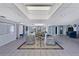 Bright and spacious lobby area with comfortable seating, skylight, and tile flooring at 19029 Us Highway 19 N # 8-31, Clearwater, FL 33764