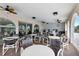 Covered outdoor seating area with multiple tables and chairs, perfect for gathering and socializing at 19029 Us Highway 19 N # 8-31, Clearwater, FL 33764