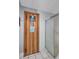 Sauna and shower, featuring a wooden door and tiled enclosure, offering a relaxing amenity at 19029 Us Highway 19 N # 8-31, Clearwater, FL 33764