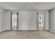 Bright bedroom featuring plush carpeting, neutral decor, and large windows at 1903 Canterbury Ln # B24, Sun City Center, FL 33573