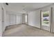 Bright bedroom featuring plush carpeting, neutral decor, and double closets at 1903 Canterbury Ln # B24, Sun City Center, FL 33573
