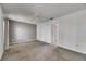 Bright bedroom featuring plush carpeting, neutral decor, and ceiling fan at 1903 Canterbury Ln # B24, Sun City Center, FL 33573