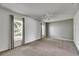 Spacious bedroom with large windows, plush carpeting, and neutral decor at 1903 Canterbury Ln # B24, Sun City Center, FL 33573
