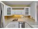 Updated kitchen with stainless appliances, granite countertops, and subway tile backsplash at 1903 Canterbury Ln # B24, Sun City Center, FL 33573
