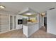 A well-appointed kitchen featuring white cabinets, stainless steel appliances, and a breakfast bar at 1903 Canterbury Ln # B24, Sun City Center, FL 33573