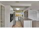 A well-appointed kitchen featuring white cabinets, stainless steel appliances, and a breakfast bar at 1903 Canterbury Ln # B24, Sun City Center, FL 33573