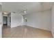 Large living room with tile flooring, ample natural light, and access to the backyard at 1903 Canterbury Ln # B24, Sun City Center, FL 33573