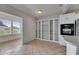 Tile flooring, a sunroom, and white cabinets in this bright, open-concept living space at 1903 Canterbury Ln # B24, Sun City Center, FL 33573