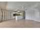 Bright, airy living space with tile floors, a ceiling fan, and an open layout at 1903 Canterbury Ln # B24, Sun City Center, FL 33573