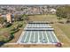 Aerial view of shuffleboard courts with shaded benches and manicured landscaping at 1903 Canterbury Ln # B24, Sun City Center, FL 33573