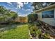 Landscaped backyard with rock garden and healthy lawn offering a private outdoor retreat at 2559 Redwood Cir, Clearwater, FL 33763
