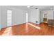 Spacious bedroom featuring wood floors and bright natural light from three windows at 2559 Redwood Cir, Clearwater, FL 33763