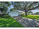 A beautiful home with an attached garage and a driveway lined with green grass at 2559 Redwood Cir, Clearwater, FL 33763