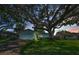 Charming single story home at dusk featuring a well-manicured lawn and mature landscaping at 2559 Redwood Cir, Clearwater, FL 33763