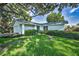 Charming single-story home with lush lawn and mature landscaping at 2559 Redwood Cir, Clearwater, FL 33763