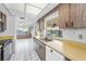 Bright kitchen featuring lots of counter space and a view of the sunroom at 2559 Redwood Cir, Clearwater, FL 33763