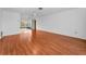 Open-concept living room with hardwood floors and access to the screened-in patio at 2559 Redwood Cir, Clearwater, FL 33763