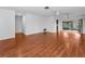 Spacious living room with hardwood floors and a sliding glass door to the backyard at 2559 Redwood Cir, Clearwater, FL 33763