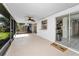 Enclosed patio with ceiling fan, tiled floor, and sliding doors, perfect for outdoor relaxation at 2559 Redwood Cir, Clearwater, FL 33763