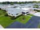 Aerial view of villa featuring well-maintained landscaping and a screen enclosed sunroom at 2814 Highlands Blvd # B, Palm Harbor, FL 34684