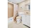 Cozy bathroom with tiled shower and vanity with a white storage cabinet at 2814 Highlands Blvd # B, Palm Harbor, FL 34684