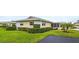Inviting villa with manicured lawn and lush landscaping creating a welcoming curb appeal at 2814 Highlands Blvd # B, Palm Harbor, FL 34684