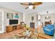 Inviting living room with hardwood floors, comfortable seating, and open layout connecting to dining area at 2814 Highlands Blvd # B, Palm Harbor, FL 34684