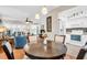 Open-concept living room featuring a round table, tile flooring, and living area with lots of natural light at 2814 Highlands Blvd # B, Palm Harbor, FL 34684