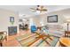 Bright living room featuring hardwood floors, ceiling fan, neutral paint and open access to dining area at 2814 Highlands Blvd # B, Palm Harbor, FL 34684