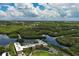 Breathtaking aerial view of community surrounded by water with lush mangrove forests and a canal at 2900 45Th S St # 26, Gulfport, FL 33711