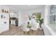 Cozy dining space with a glass table, comfortable seating, and views into the modern kitchen and backyard at 2900 45Th S St # 26, Gulfport, FL 33711