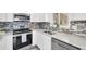 Modern kitchen boasting stainless appliances, light countertops, and tile backsplash at 2900 45Th S St # 26, Gulfport, FL 33711