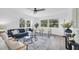 Bright living room with sleek flooring, modern furniture, and natural light, offering a cozy and stylish space at 2900 45Th S St # 26, Gulfport, FL 33711