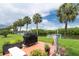 Charming outdoor patio area with a grill and lush landscaping, great for entertaining guests at 2900 45Th S St # 26, Gulfport, FL 33711