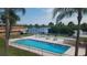 Community pool with lounge chairs and dining areas overlooking a waterway at 2900 45Th S St # 26, Gulfport, FL 33711