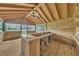 Inside the bar shed featuring a bar, ceiling fan, and screened windows providing natural light at 302 Old Mulrennan Rd, Valrico, FL 33594