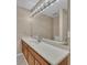 Bathroom featuring a vanity with a white countertop and a large mirror at 302 Old Mulrennan Rd, Valrico, FL 33594