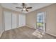 Bedroom featuring neutral walls, ceiling fan, carpet, and a window at 302 Old Mulrennan Rd, Valrico, FL 33594