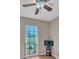 Bedroom featuring a window with a view and ceiling fan at 302 Old Mulrennan Rd, Valrico, FL 33594