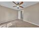 Carpeted bedroom with neutral walls and a ceiling fan at 302 Old Mulrennan Rd, Valrico, FL 33594