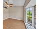 Bright bedroom with wood floors and a large bay window at 302 Old Mulrennan Rd, Valrico, FL 33594