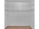 Spacious walk-in closet featuring ample white shelving at 302 Old Mulrennan Rd, Valrico, FL 33594
