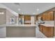 Open kitchen with stainless steel appliances and a breakfast bar offering seating at 302 Old Mulrennan Rd, Valrico, FL 33594