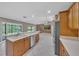 Spacious kitchen open to the living area with stainless appliances and lots of natural light at 302 Old Mulrennan Rd, Valrico, FL 33594