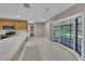 Bright kitchen with stainless appliances and a sunny bay window area at 302 Old Mulrennan Rd, Valrico, FL 33594