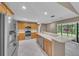 Modern kitchen featuring stainless steel appliances and an island at 302 Old Mulrennan Rd, Valrico, FL 33594