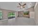 Spacious living room featuring tile floors and a brick fireplace at 302 Old Mulrennan Rd, Valrico, FL 33594