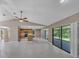 Open-concept living space with a kitchen and outdoor access at 302 Old Mulrennan Rd, Valrico, FL 33594