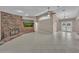 Spacious living room with tile floors, brick fireplace, and TV at 302 Old Mulrennan Rd, Valrico, FL 33594