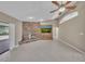 Bright living room with a brick fireplace and vaulted ceiling at 302 Old Mulrennan Rd, Valrico, FL 33594